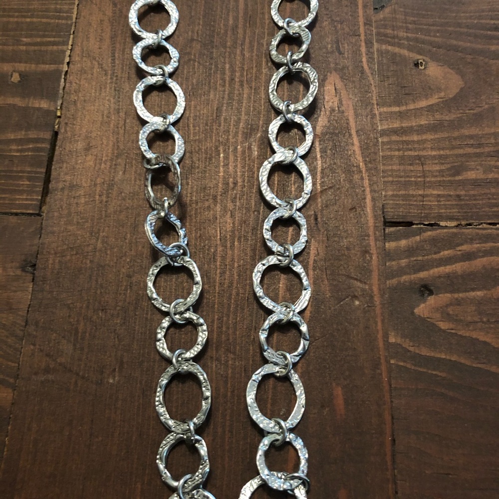 Long silver ringed necklace